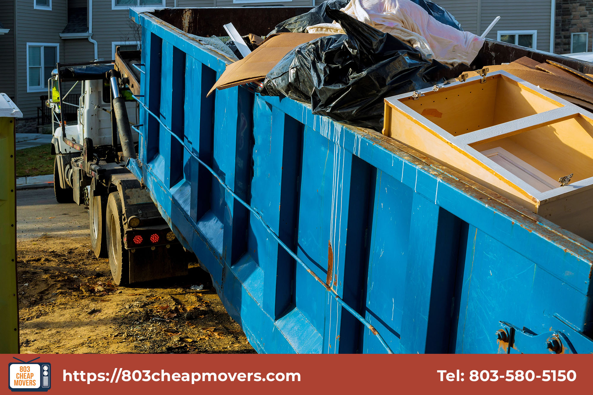 large metal dumpster filled with junk.jpg