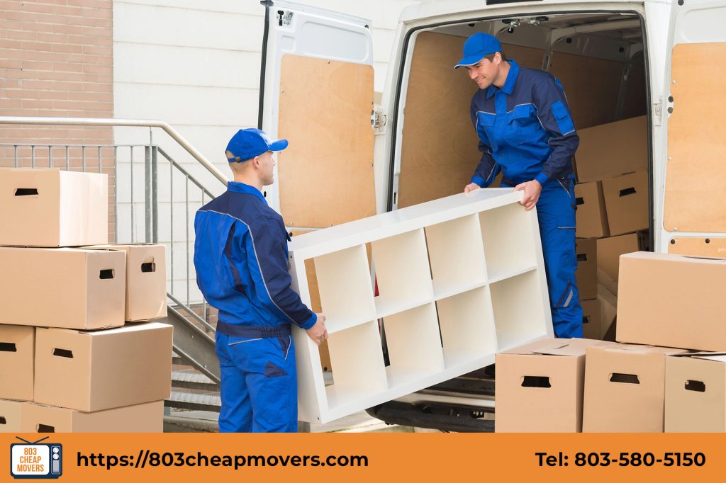 furniture movers carrying bookshelf outdoors.jpg