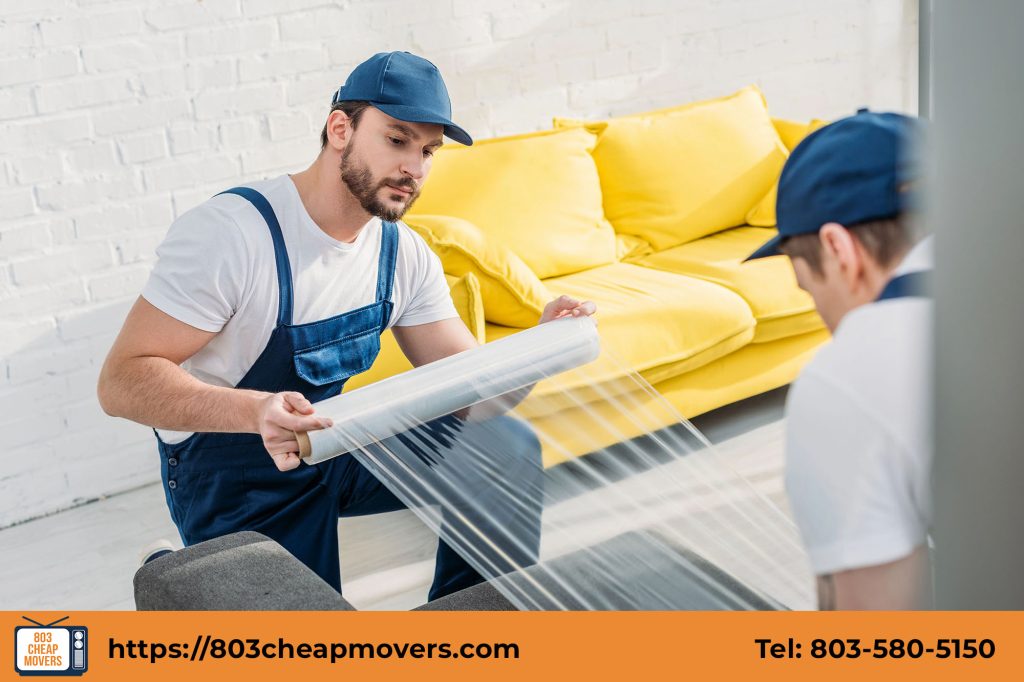 professional movers assembling a sofa